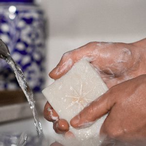 Sierra's hands holding Earth Salt Black Altar