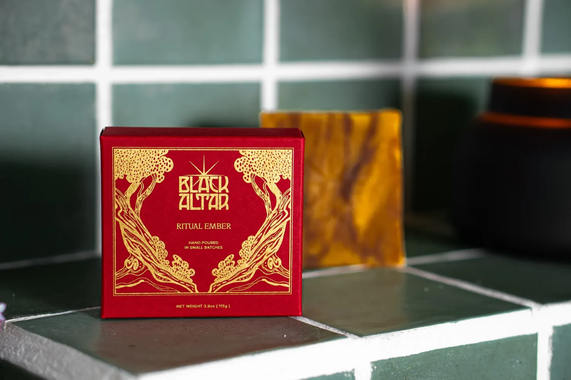 Black Altar Ritual Ember red boxed soap with warm amber bar on tile