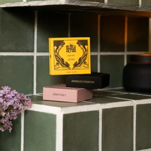 Black Altar yellow boxed soap featured above black and pink boxes