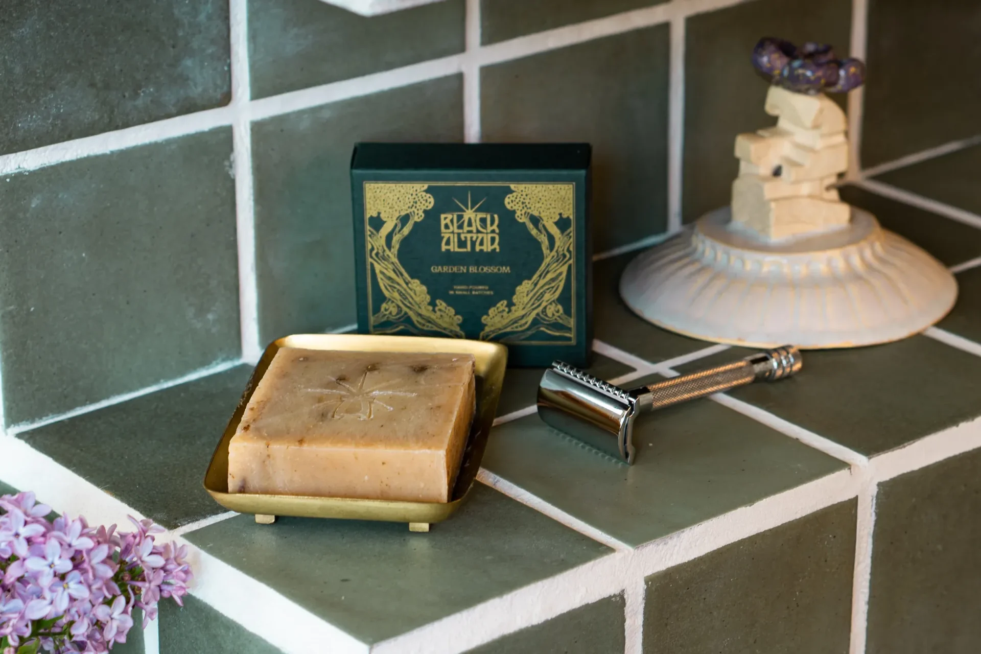 Black Altar green gold boxed soap with pale bar on a tray and sculptural prop