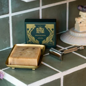 Black Altar green gold boxed soap with pale bar on a tray and sculptural prop