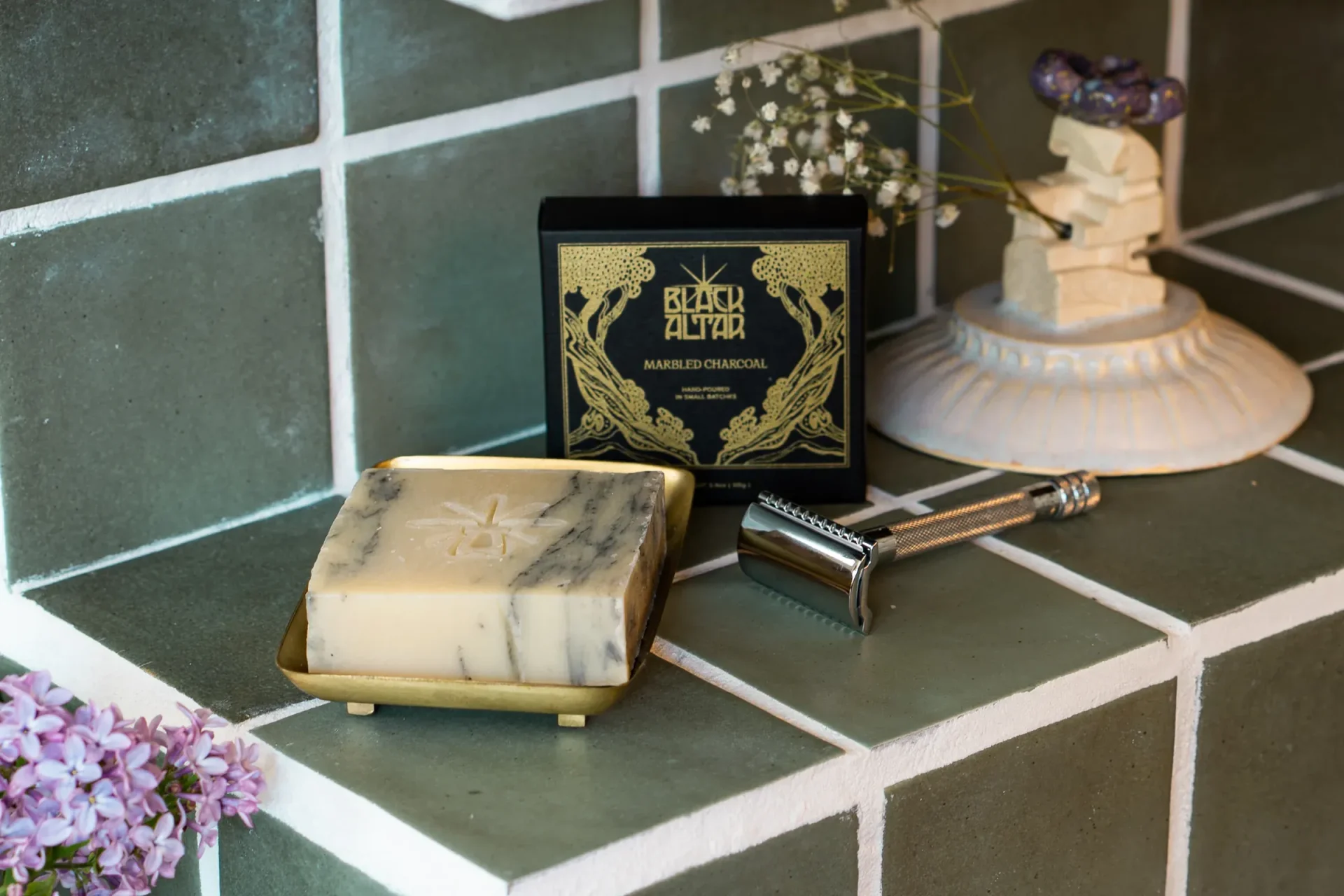Black Altar black gold boxed soap with pale marbled bar on a brass tray