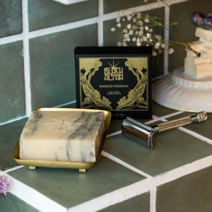 Black Altar black gold boxed soap with pale marbled bar on a brass tray