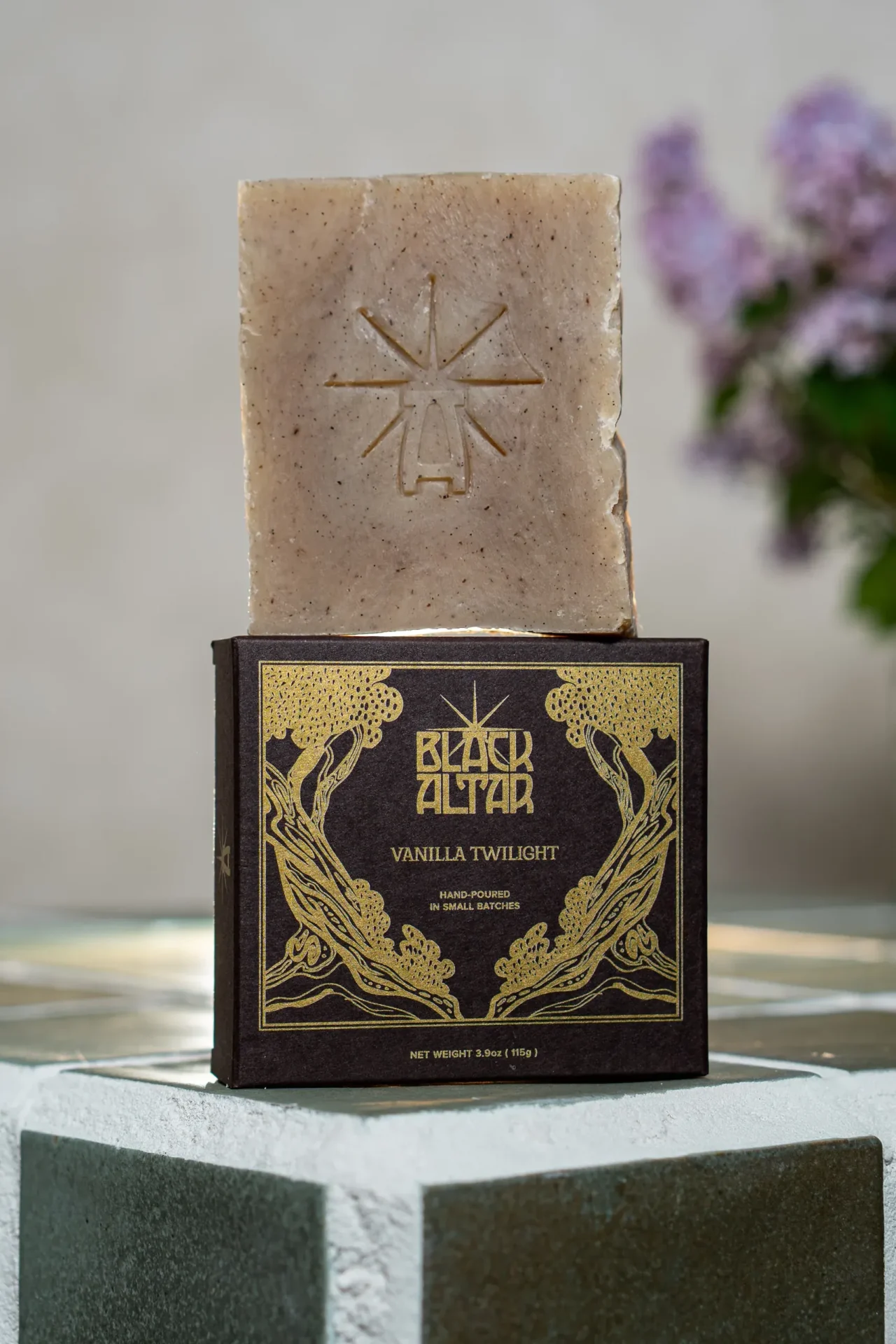 Black Altar black gold boxed soap with taupe speckled bar behind