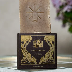 Black Altar black gold boxed soap with taupe speckled bar behind