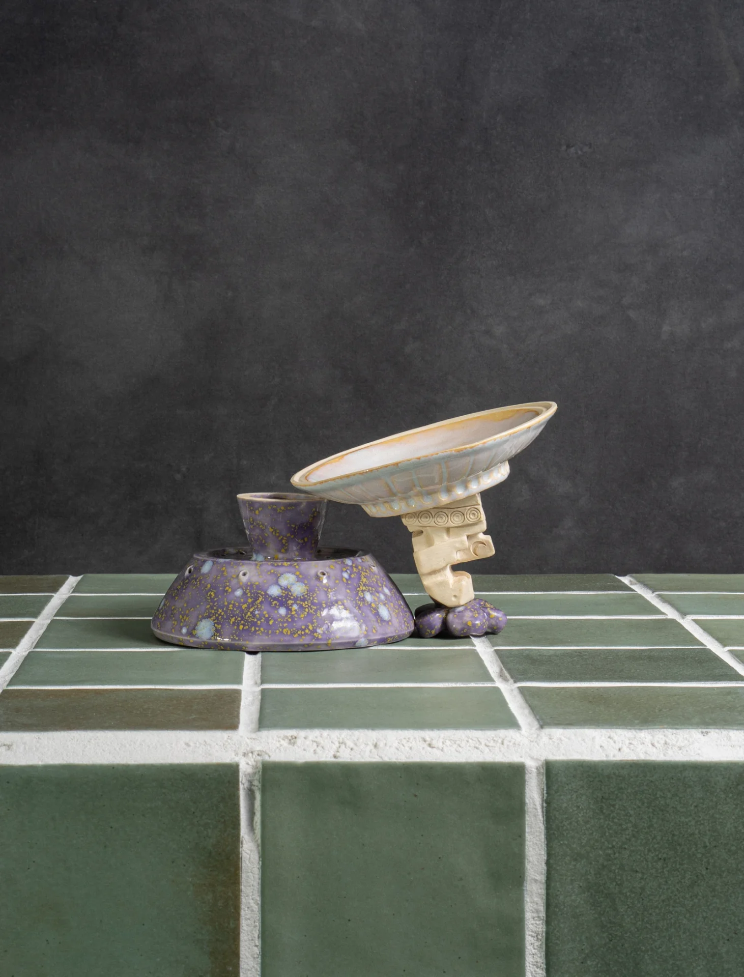 Flying Saucer base tipped forward showing the draining dish