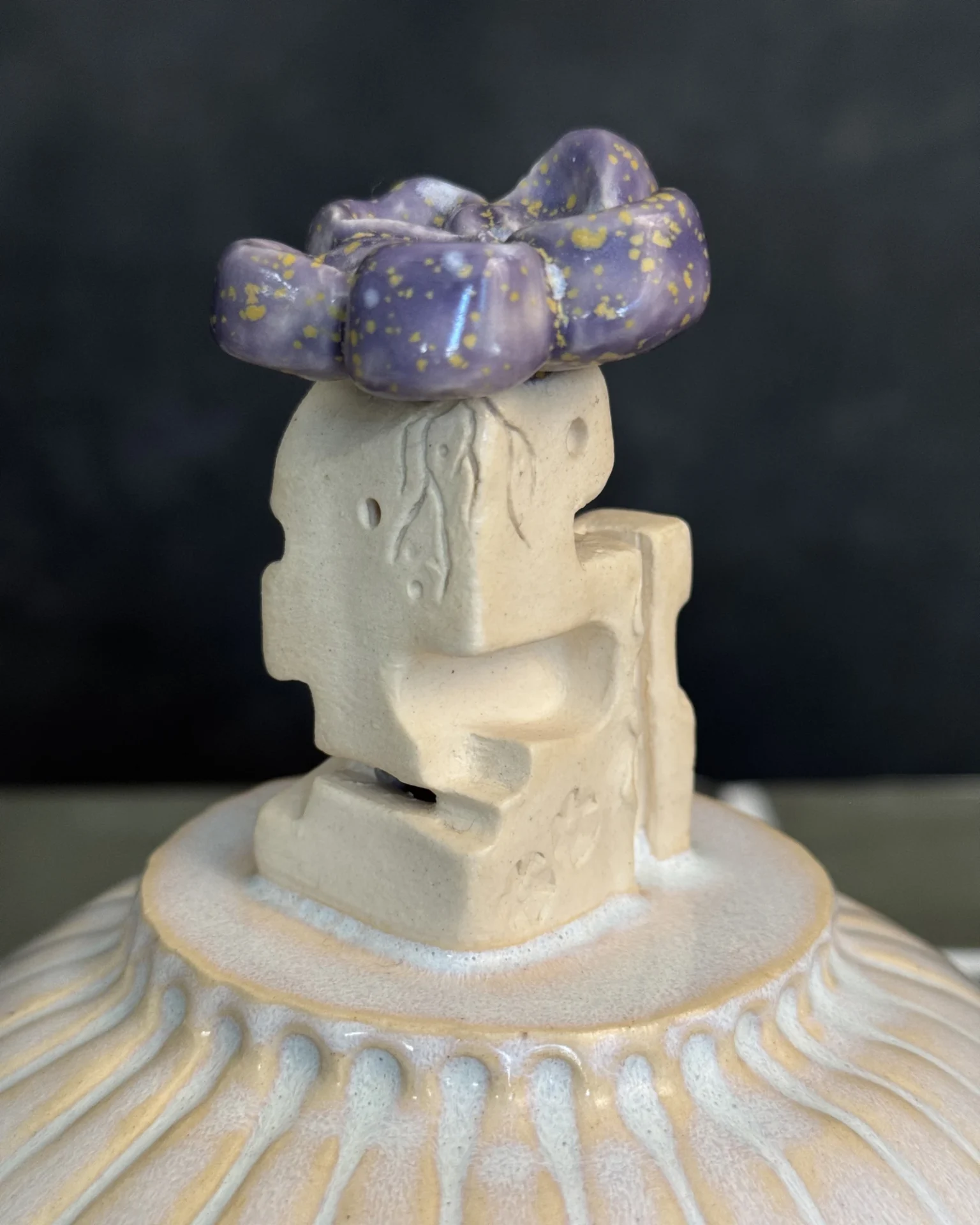 Alien rider close-up, speckled purple glaze above
