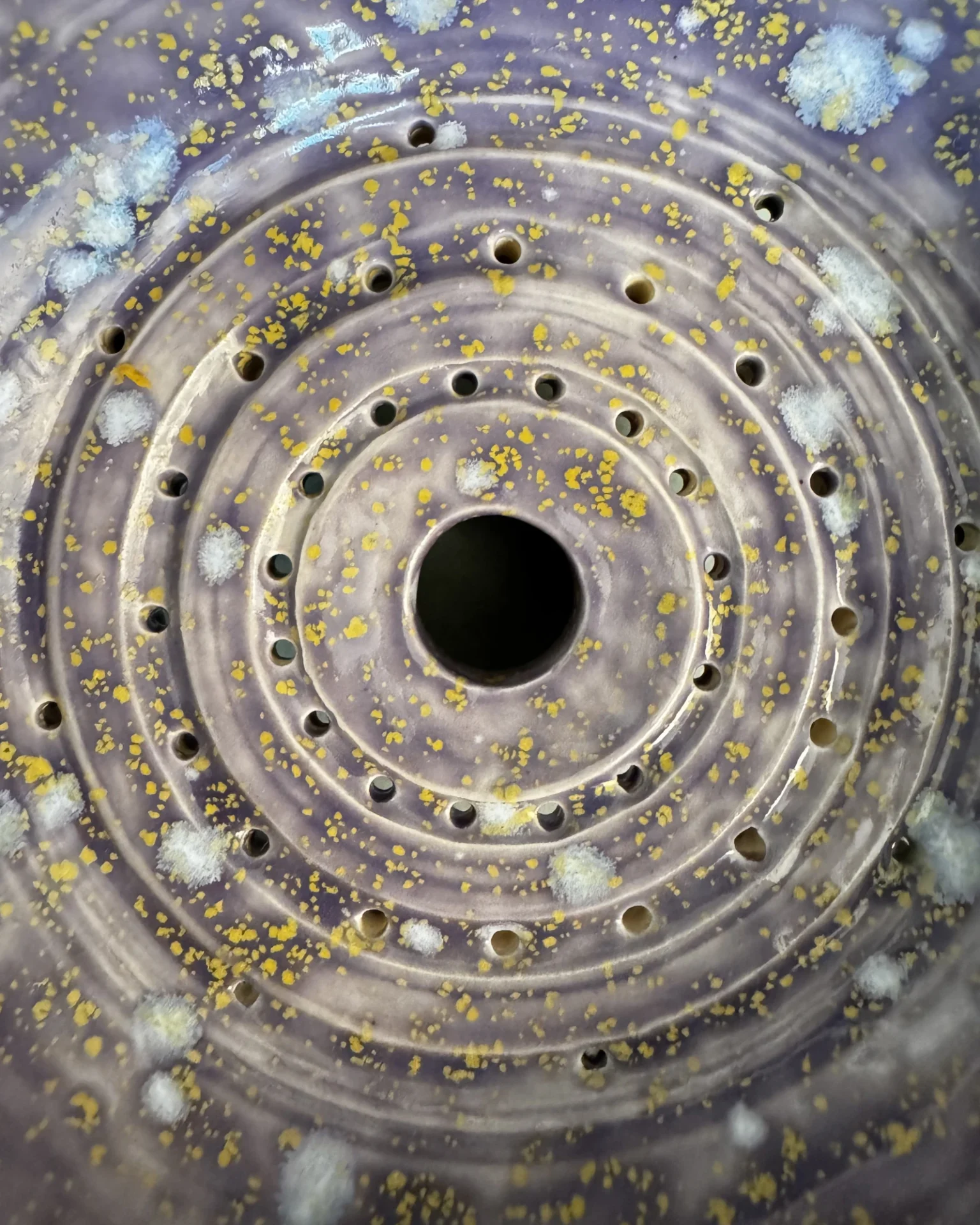 Drainage rings inside the Flying Saucer base, speckled glaze